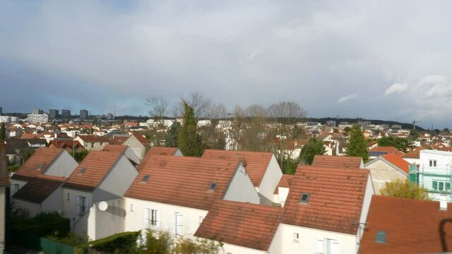 Suburban Neighborhood Town Row Houses. POV View out  of RER Train Window. Paris Suburbs near Railway. Ile-de-France Europe. 2020. 2x Slow motion 60 fps 4K