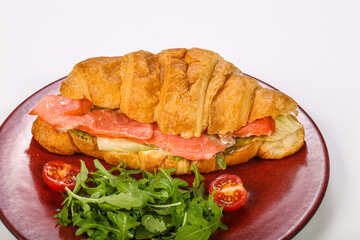 Croissant with salmon for breakfast