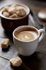 Cup of coffee on rustic wooden background. Close up.	