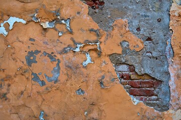 abstract part of the old brick wall with ruined plaster for vintage background and wallpaper