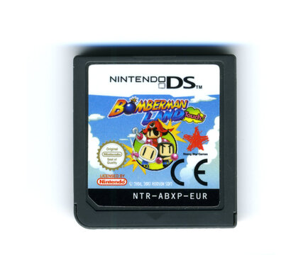 London, England, 26/05/20202 A bomber man land touch nintendo ds video game cartridge isolated on a white background. Vintage retro video racing gaming.
