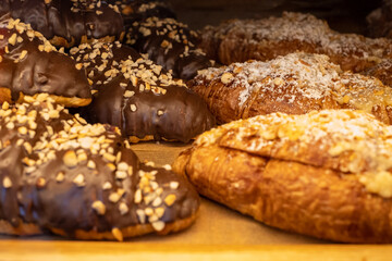Assortment of delicious and chocolate croissants made by pastry chef. All look very tasty and delightful. Natural light.