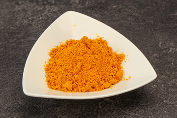 Tumeric powder in the bowl