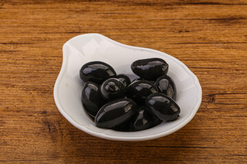Pickled black olives in the bowl