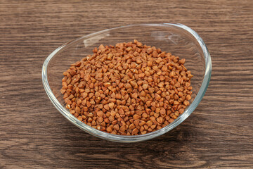 Raw buсkwheat cereal in the bowl