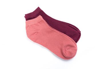 two pairs of colored short socks on a white background, top view