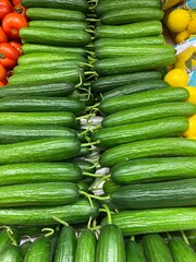 cucumbers in seller's case, top view.