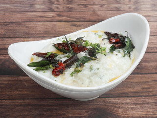 Vegetarian meal, Tasty Curd rice or Dahi Bhat or Dahi Chawal with spices.Rice mixed with yogurt and seasoning, selective focus