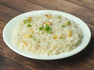 Cumin rice or Jeera Rice is a popular Indian main course item made using Basmati rice flavored with fried cumin seeds and basic spices, selective focus