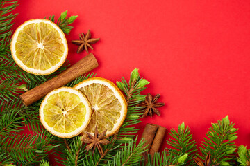 Christmas composition with fir branches, dried orange slices and spices