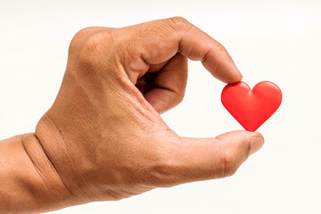 Obraz premium Little Heart in hand of old man. heart disease, Heart Disease Prevention, Health care 