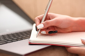 Fototapeta premium woman study hard write down information to notebook education concept