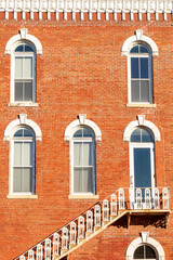 old vintage exterior staircase on the side of a downtown building.  Geneseo, Illinois. © Nicola