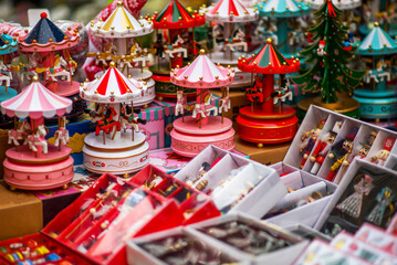 Colorful decorations on a European traditional Christmas market. Shopping on traditional Christmas market. Shopping, winter holidays souvenir shop.