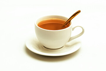 White cup of tea and herbal beverage, Top view, golden spoon, isolated white background