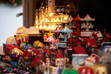 Colorful decorations on a European traditional Christmas market. Shopping on traditional Christmas market. Shopping, winter holidays souvenir shop.