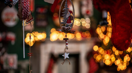 Gift, decorations, garland on a background of bokeh Christmas garlands. Christmas market, winter,...