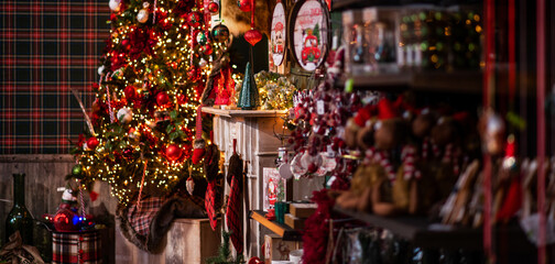 Colorful decorations on a european traditional Christmas market. Window shopping on traditional Christmas market. Shopping, winter holidays souvenir shop on town square.