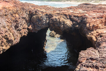 View of the spectacular Forrest Caves at low tide on Surf Beach, Phillip Island, Victoria, Australia