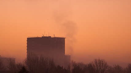 Sunrise over a city tower block in the UK