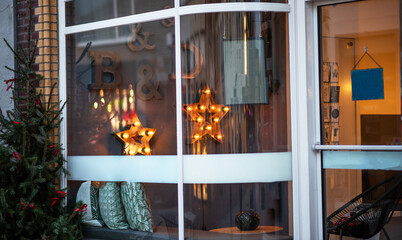 Beautiful decoration. Shopping on traditional Christmas market in european city. Illumination and decorations. Traditional christmas market in the historic center. Festive fair on background.