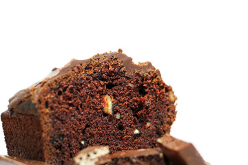 Wet chocolate cake with chocolate icing. Homemade cakes on white background