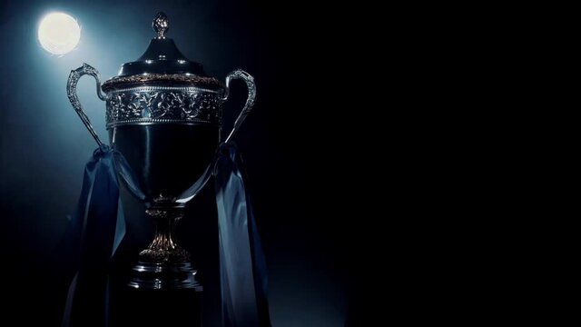 Silver trophy cup standing isolated. Premium award of sport achievement. Best prize for sport success. Brilliant result of playoff and championship. Concept of winner, breakthrough and champion