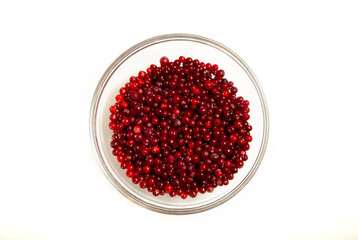 cranberries in a glass bowl on a white background, flat lay