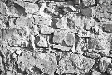 gray background.wall of stones and bricks