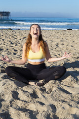 Fototapeta na wymiar yoga at a clifornia beach