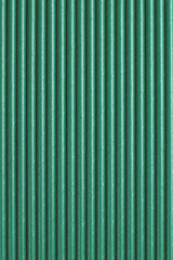 Green paper straws as background. Top view