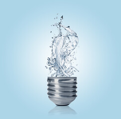 Light bulb with water splashes on light blue background. Alternative energy source