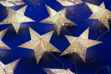 decorations for the holiday. white paper stars.background for Christmas and new year holidays.