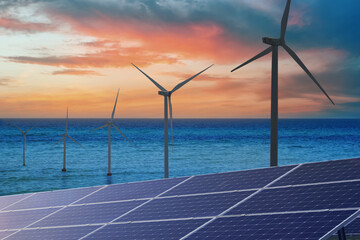 Alternative energy sources. Wind turbines installed in water, solar panels on foreground