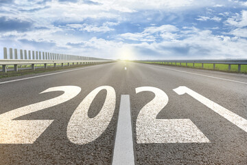 Start new year with fresh vision and ideas. 2021 numbers on asphalt road