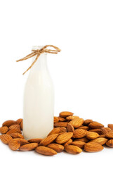 Vegetarian almond milk. Almonds and almond milk in a bottle. Isolated on white.