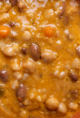 organic and vegetarian soup with legumes, vegetables and cereals