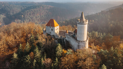 Aerial fall view of old stone Kokorin Castle built in 14th century.It lies in the middle of nature reserve on a steep rocky spur above the Kokorin Valley.Popular historical monument in Czech republic.