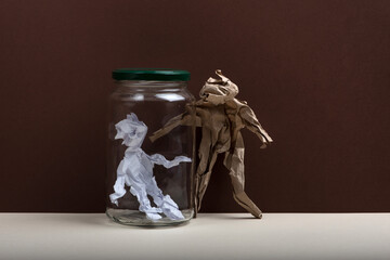 Human figures made from crumpled paper. Isolation concept.