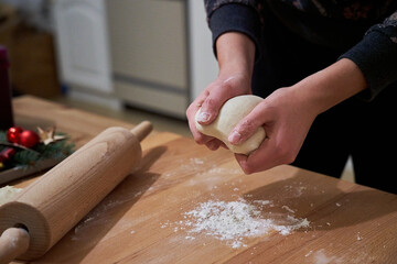 Closeup of female hands baking