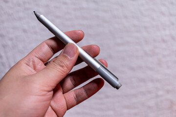 Close-up of Holding ilver stylus pen