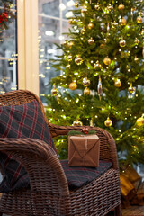 Home Christmas decoration interior late in night with light on xmas tree and gifts.