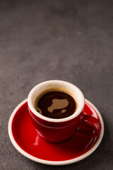 Fototapeta premium Black brewed coffee in a red cup