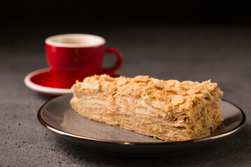 Napoleon cake close-up on a dark background