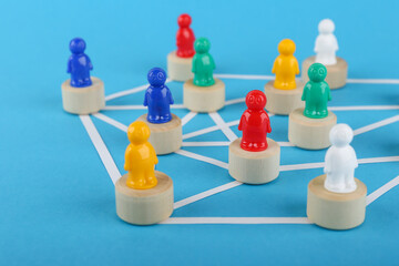 the concept of connections in an abstract community. multicolored figures of people in the form of a community. 