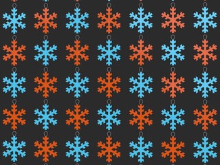 Red and blue snowflake Christmas tree decorations - dark gray background