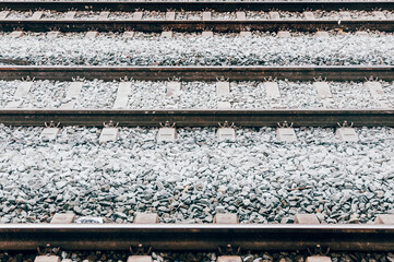 Several parallel railway tracks with ballast and sleepers in Amsterdam the Netherlands