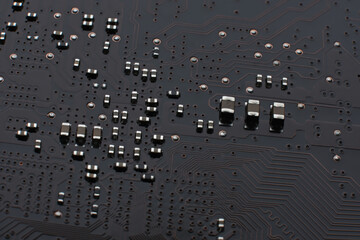 Brown motherboard with a lot of smd components. Huge number of different size ceramic surface mount...