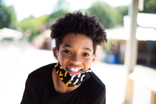 Happy And Smiling Black Boy Outside At Park