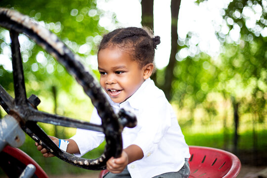 Toddler portrait on family farm tractor